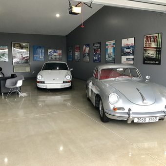 Classic Porsche Garage with Wall Art and Lounge Area - Kevin