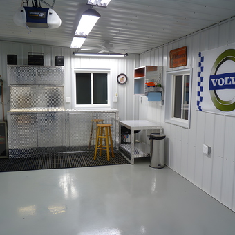 Organized garage with diamond plate cabinets and Volvo sign - Dave from Marshalltown, IA