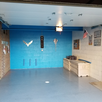 Organized Garage With Blue Wall Art and Storage Bench - Paula from Crescent, PA