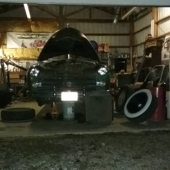 Classic car restoration garage with tools and tires - Dan from Athol, Id