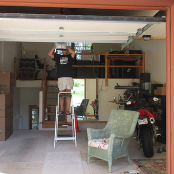 Organized garage with motorcycle, tool storage, and loft - TALBOT'S SPEED SHOP from Edwards, Colorado