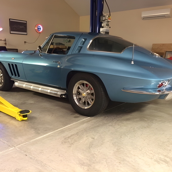 Classic Blue Corvette on Car Lift in Garage - John's Toy Emporium from Beavercreek, OH