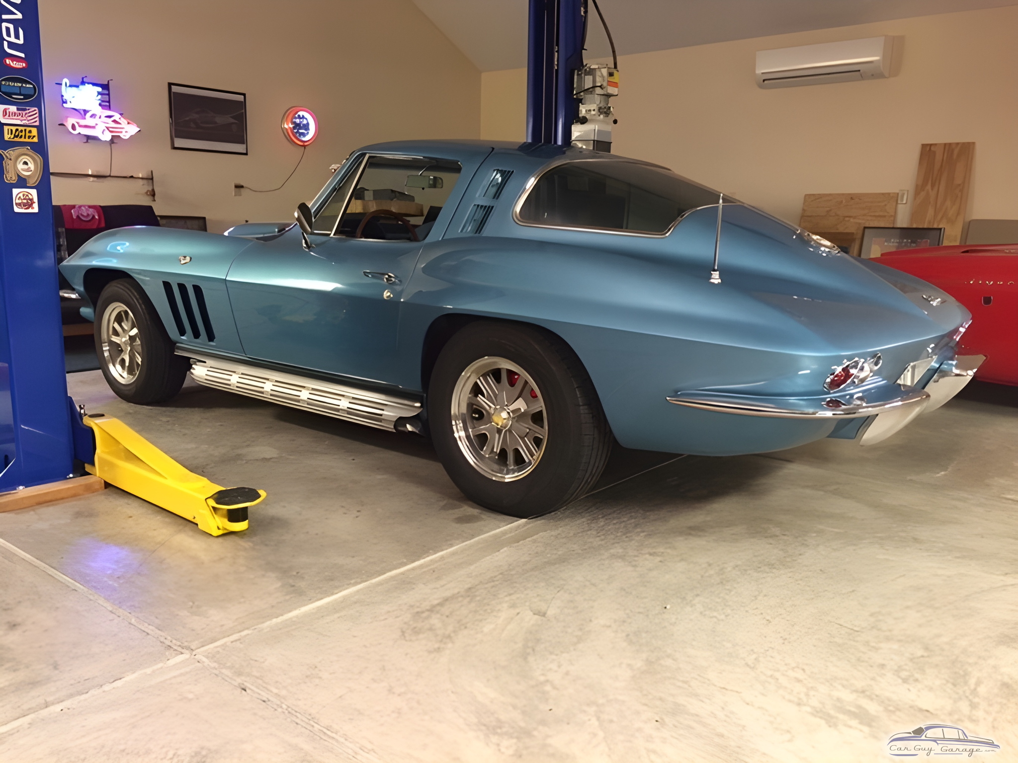 Classic Blue Corvette on Car Lift in Garage - John's Toy Emporium from Beavercreek, OH