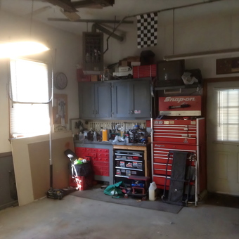 Organized garage with red tool cabinets and workbench - Tom from East Longmeadow, Ma
