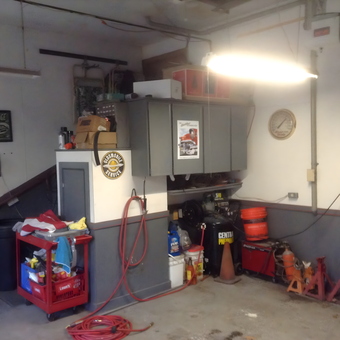 Organized garage with cabinets, tool cart, and air compressor - Tom from East Longmeadow, Ma