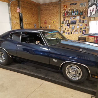 Classic Car on Lift with Wall Decor - Crago from Huntington, Indiana
