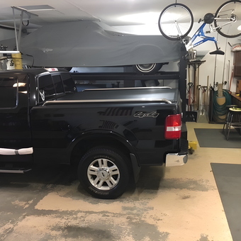 Organized Garage with Truck Lift, Bike Rack, and Storage - Eric from Elko New Market, MN
