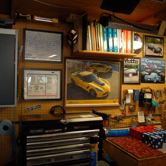 Organized Garage Wall with Cabinets, Tools, and Corvette Decor - Black'95 from Roscoe, SD