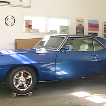 Classic Blue Car on Dollies in Organized Garage - HonestBob from Lansing, Michigan