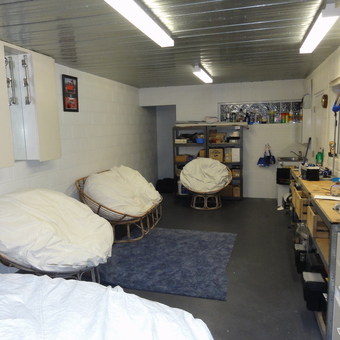 Organized garage with lounge chairs, shelving, and workbench - Hobart Garage Guy from Sandy Bay, Tasmania