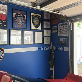 Police Memorabilia Wall and Red Car in Garage - Jay from Massapequa, New York