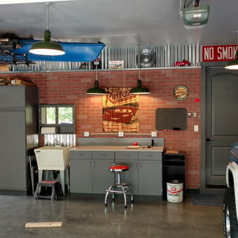 Organized garage with cabinets, wall signs, and classic car - blubuckaroo from Ridgefield, WA