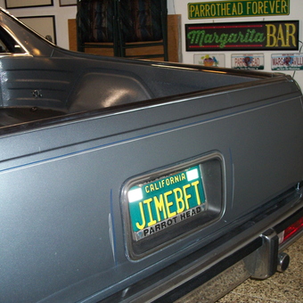 Classic car with custom license plate and garage signs - Dennis from Palm Desert, California