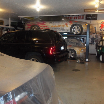 Spacious garage with car lift, covers, and SUV - daytonajim from Balsam Lake, WI