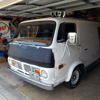 Classic Custom White Van with Accessories in Garage - SUMR 69 from WEST FARGO, North Dakota