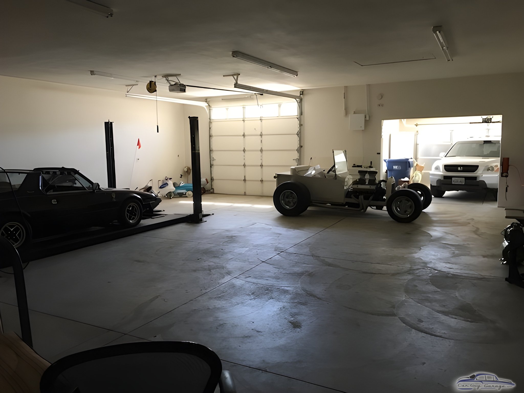 Spacious garage with car lift and classic vehicles - Anthony Natoli from Agua Dulce, California