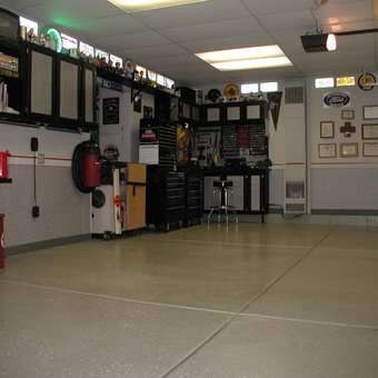 Organized garage with cabinets, tool chests, and wall decor - Rdgliot from Lake in the Hills, IL