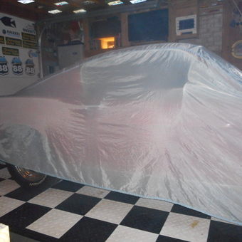 Garage with Car Cover, Checkered Floor, Wall Signs - Chip from Chattanooga, Tennessee