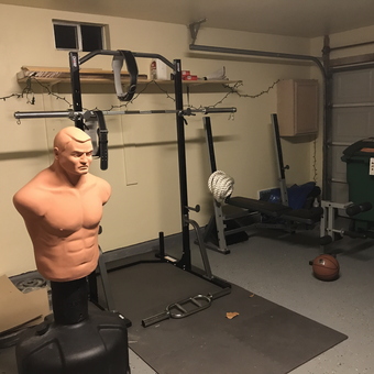 Home Gym Garage With Bench, Punching Dummy, and Weights - Eric Solis from San Antonio, TX