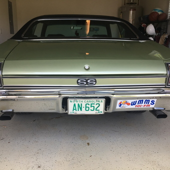 Classic Chevy SS in Clean Garage with Sports Gear - Islandlog