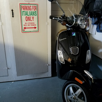 Garage with Vespa Scooter and Parking Signs - RJC Garage from Hayward, CA