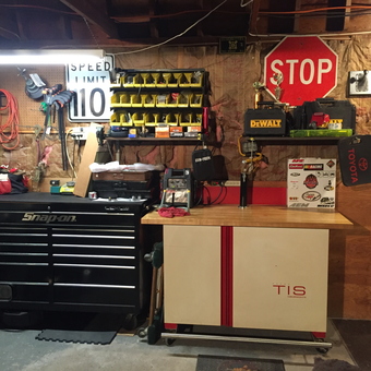 Organized garage with tool chest, workbench, and wall storage - CarDr from Cumberland, RI