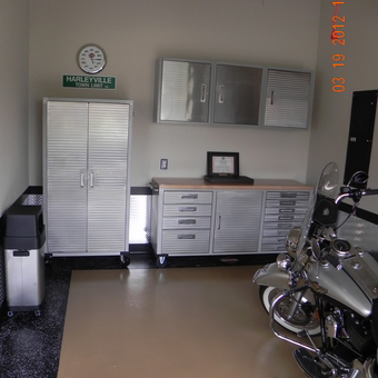 Organized garage with metal cabinets and Harley motorcycle - remzy from Rogers, AR
