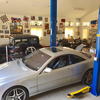 Organized Garage with Car Lift, Classic Cars, and Wall Decor - Mikey Farfan from Coarsegold, CA