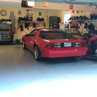 Organized garage with red car, motorcycle, tool chest - Big Chris from Hampton, GEORGIA