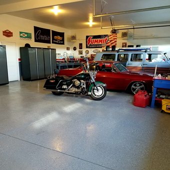Organized garage with storage cabinets and classic vehicles - Jim from Cheyenne, WY