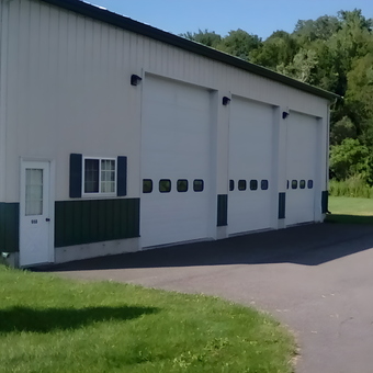 Large metal garage with three overhead doors - Tovar from Cheshire, Mass.