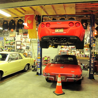 Classic Cars, Wall Signs, and Car Lift in Garage - Micco Speed Shop from Micco, FL