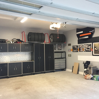 Organized garage with cabinets, tool chests, and wall art - Makintrouble973 from Ottawa, Ontario