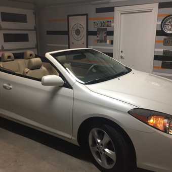 Stylish garage with wall decor and convertible car - Makintrouble973 from Ottawa, Ontario