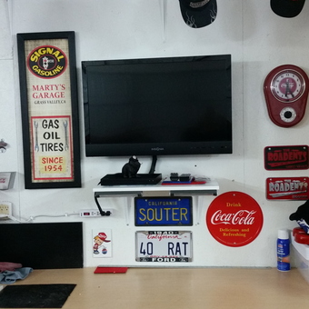 Garage wall with vintage signs, TV, and tool chest - MR COKE from GRASS VALLEY, CA