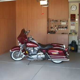 Organized garage with motorcycle, cabinets, and workbench - Dave from Parker, CO