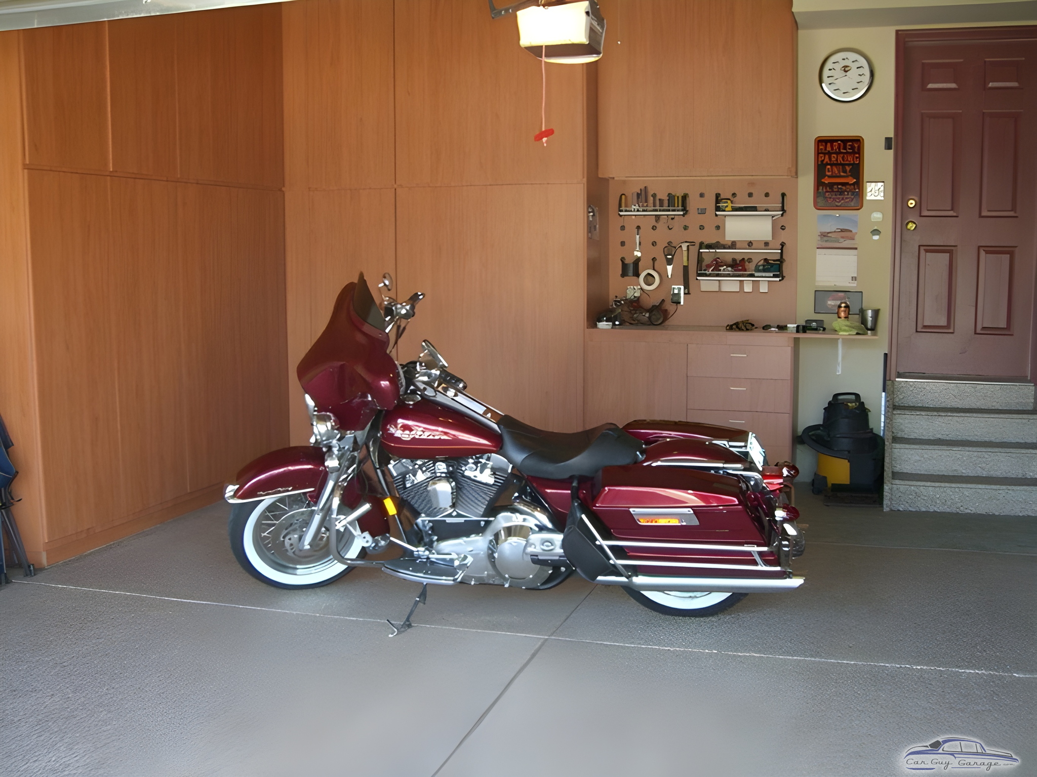 Organized garage with motorcycle, cabinets, and workbench - Dave from Parker, CO