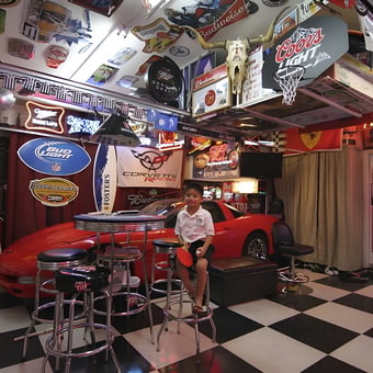 Ultimate car-themed garage with neon signs and bar stools - Kalabaw from Las Vegas, NV