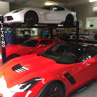 Luxury Sports Cars with Four Post Car Lift - Anonymous