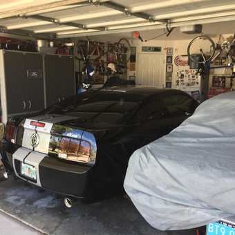 Organized garage with Mustang, cabinets, and wall racks - Rodhog from Oviedo, Fl