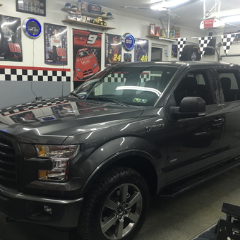 Race-themed garage with Ford F-150 and wall decor - Rick from Bridgeville, Pa