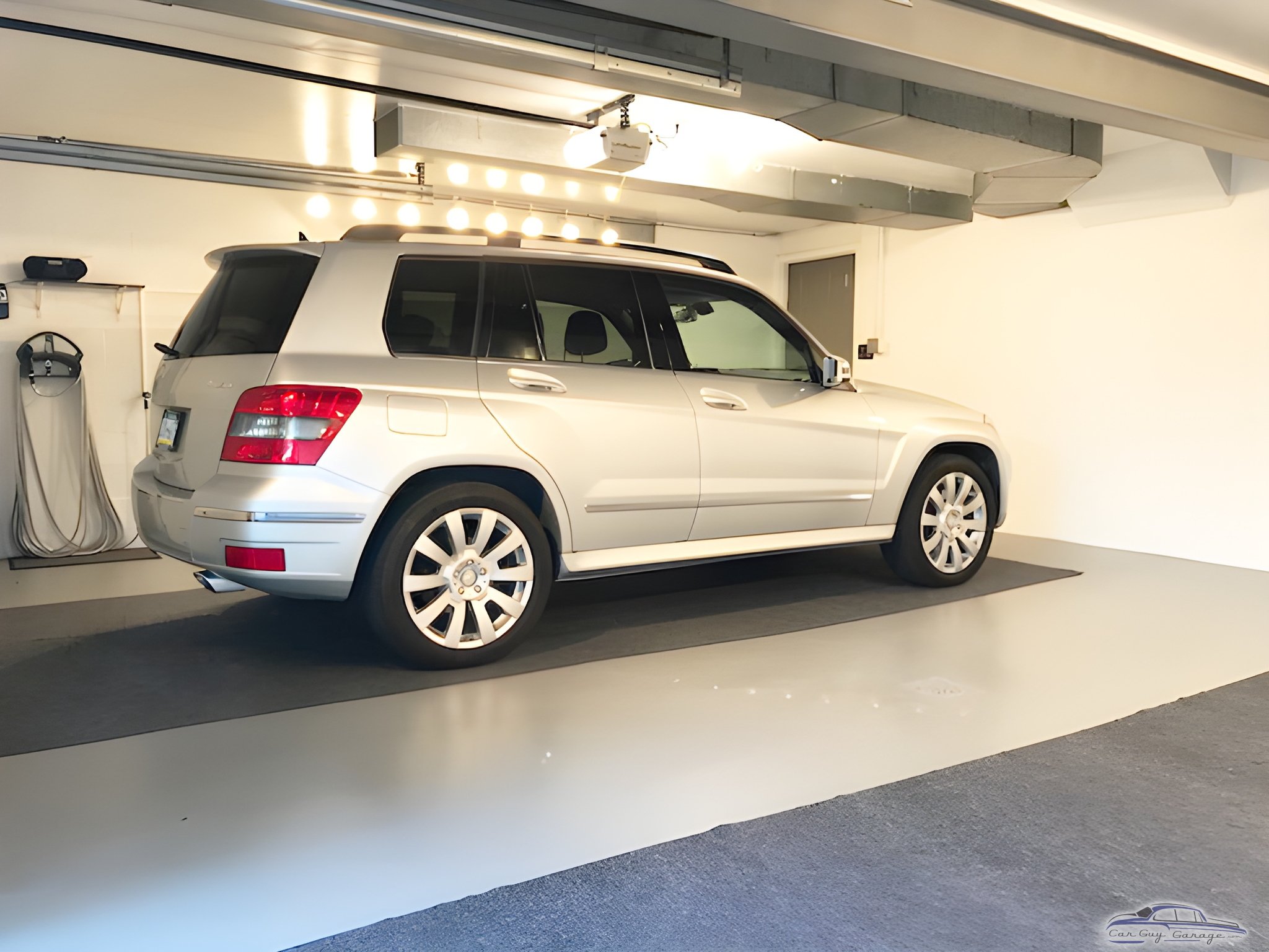 Clean garage with silver SUV and wall-mounted EV charger - Bob from Clairton, PA