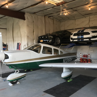 Garage with Airplane, Car Lift, and Sports Cars - Rodney from East Hampton, NY