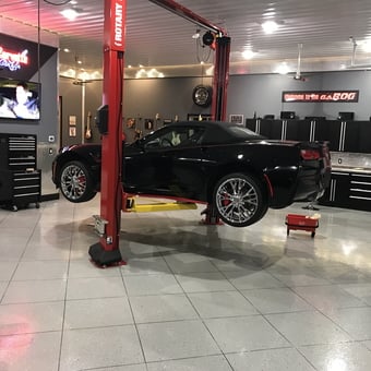 Modern garage with car lift and cabinets - Roger from Grand Forks, ND