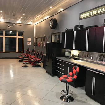 Modern garage with black cabinets and checkered stools - Roger from Grand Forks, ND