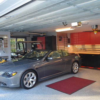 Organized garage with cabinets, storage, and BMW - Mr. 650i from Saint Helena Island, SC