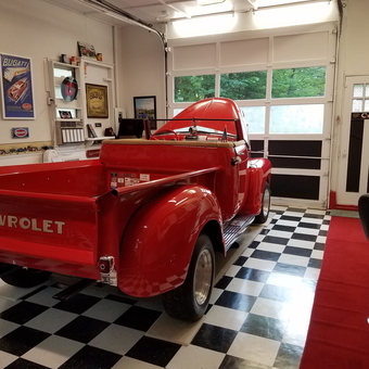 Classic Red Chevrolet Truck in Checkered Floor Garage - Maine Man from South Paris, Maine