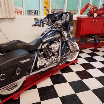 Classic Motorcycle on Lift with Red Cabinets - Maine Man from South Paris, Maine