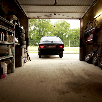 Organized garage with car, shelving, and tools - Mr_Daihatsu from Vienna, Austria