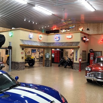 Custom garage with neon signs, classic cars, and lifts - Steve from Shoreview, MN